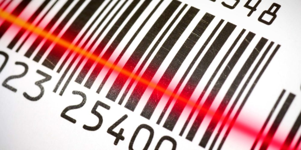 Package,Tracking,Barcode,Being,Read,By,A,Scanner. Bar code scanning a bar code