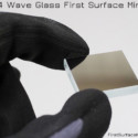 Optical grade λ/4 wave glass first surface mirror. λ/4 flatness is achieved by polishing float glass down to a flat surface, then coating with aluminum and the protective overcoat. λ/4 Wave Glass First Surface Mirror