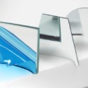 Square, trapezoid and circular optical mirrors. Samples of our optical first surface mirrors with the blue laminate peeled. The blue laminate is a protective overcoat to protect the first surface of the mirror.